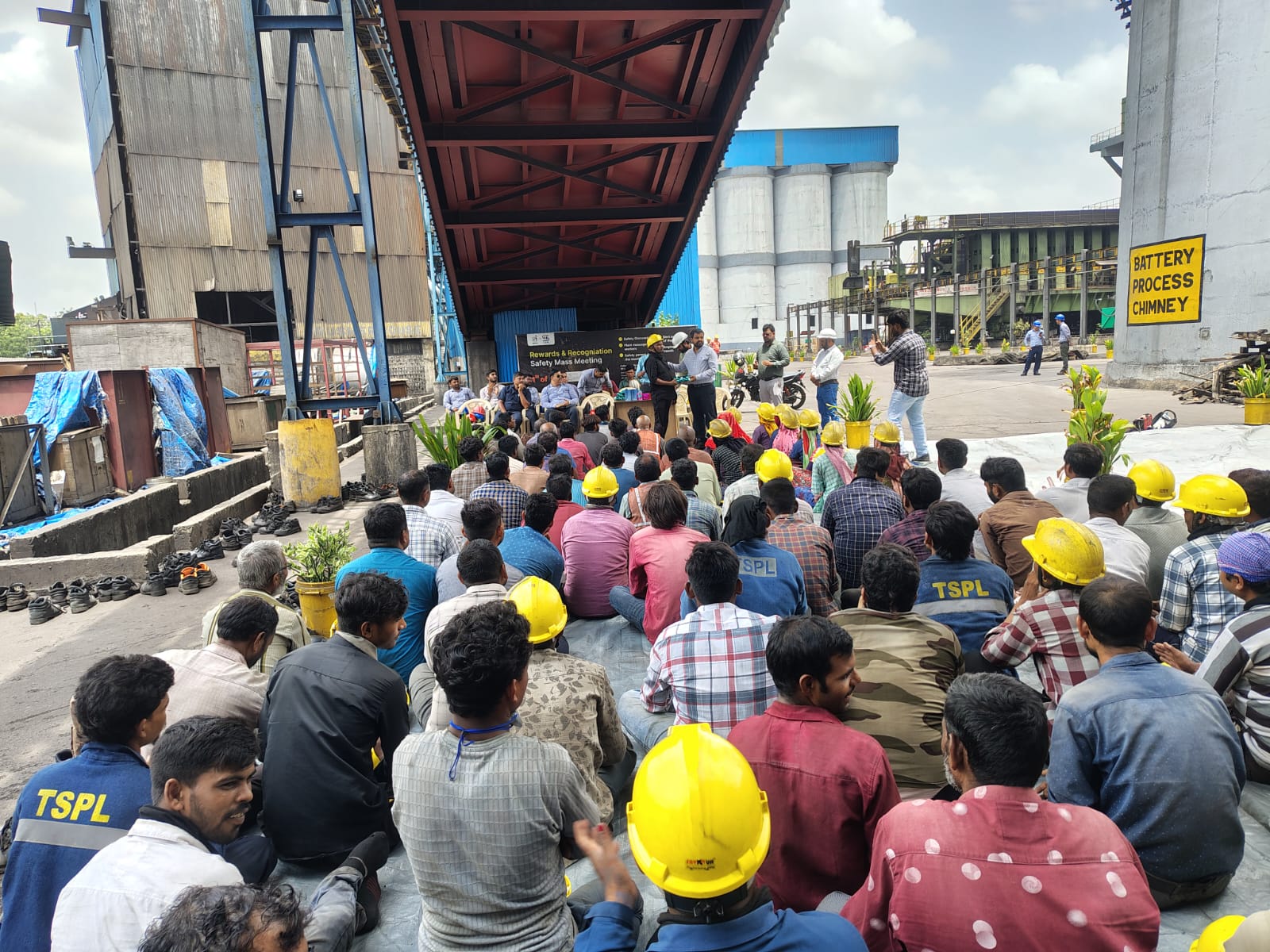 Team gathered under the plant shed for the safety session