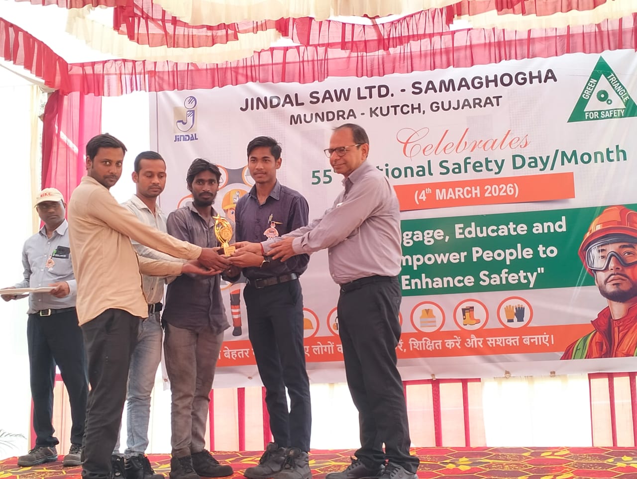 Worker receiving a token of appreciation from management